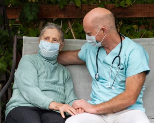 male-nurse-swing-chair-with-senior-woman